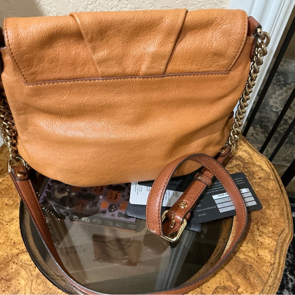 MCM shoulder bag in a tan or cognac featuring gathered flap and whipstitch trim - Picture 4 of 9